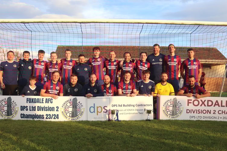 Foxdale players celebrate with the DPS Ltd Division Two trophy after completing an unbeaten league season with victory over Colby at Billy Goat Park on Tuesday evening (Photo: Paul Hatton)