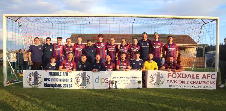 Foxdale players celebrate with the DPS Ltd Division Two trophy after completing an unbeaten league season with victory over Colby at Billy Goat Park on Tuesday evening (Photo: Paul Hatton)