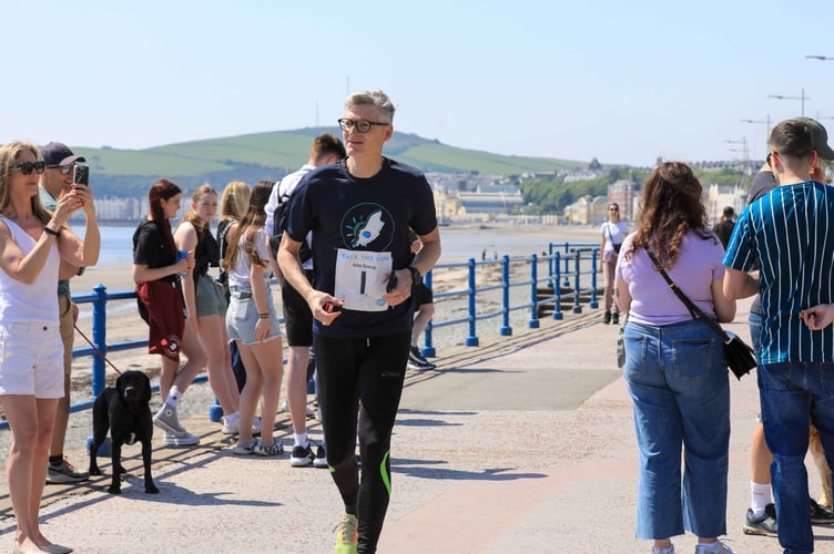 Crowds cheer on the Race the Sun runners on Douglas promenade