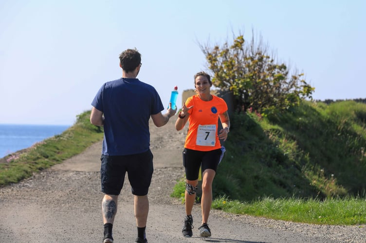 One runner receives much-needed refreshment during Race the Sun