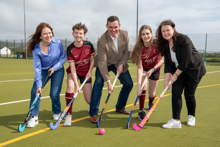 Leonard Curtis' Aidan Tucker, Sue Richardson and Jackie Renehan with representatives modelling the new QEII sports kit