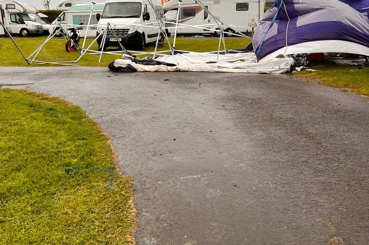 Damage to TT Paddock tents after blustery conditions overnight 