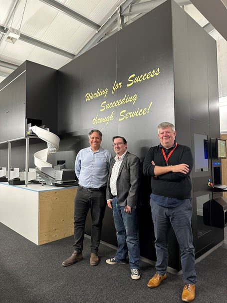 Health Minister Lawrie Hooper and DHSC chief officer Paul Richardson inspect state of art robotics with Kingsley Muti director Nick Kaye