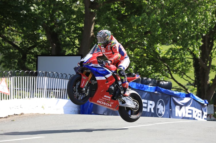 John McGuinness gets some airtime on the Honda Fireblade over Ballaugh Bridge