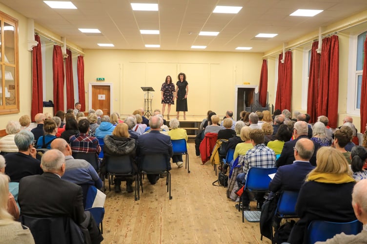 Helen Furner and Nicola O'Connor performing a ladies vocal duet at the Post Guild Concert.