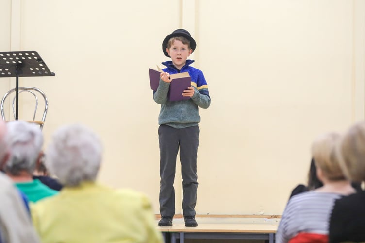 Orry Franklin reads from the Bible in Manx years at the Post Guild Concert.