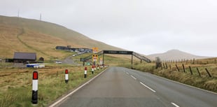 Two people receiving medical treatment on Mountain Road after crash