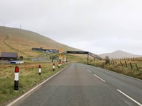 Two people receiving medical treatment on Mountain Road after crash