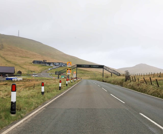 Two people receiving medical treatment on Mountain Road after crash