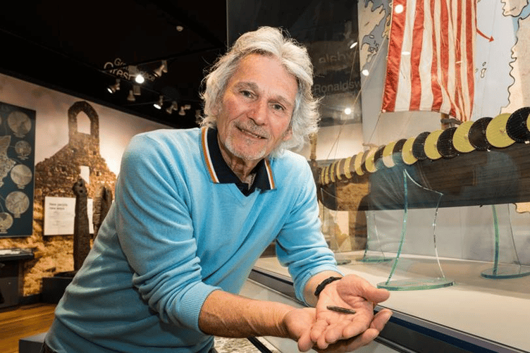 John Smart pictured with the 1,000 year old Viking silver ingot