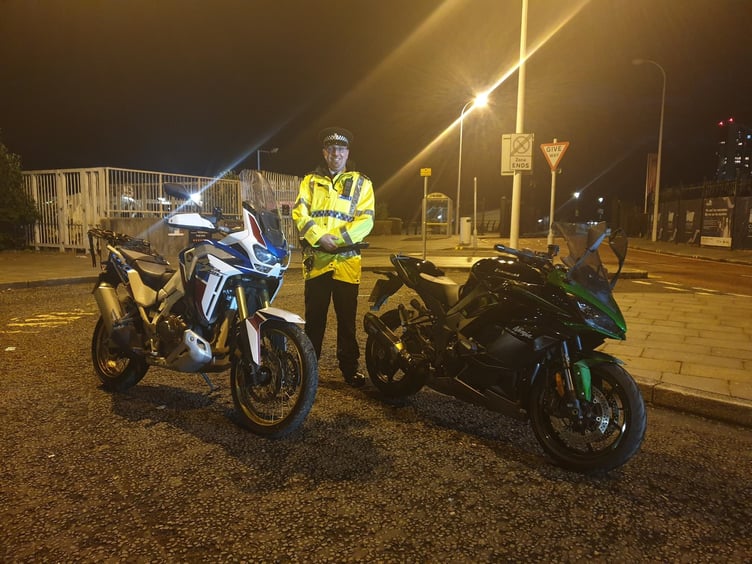 Sergeant Craig Winstanley of Merseyside police with the recovered motorcycles
