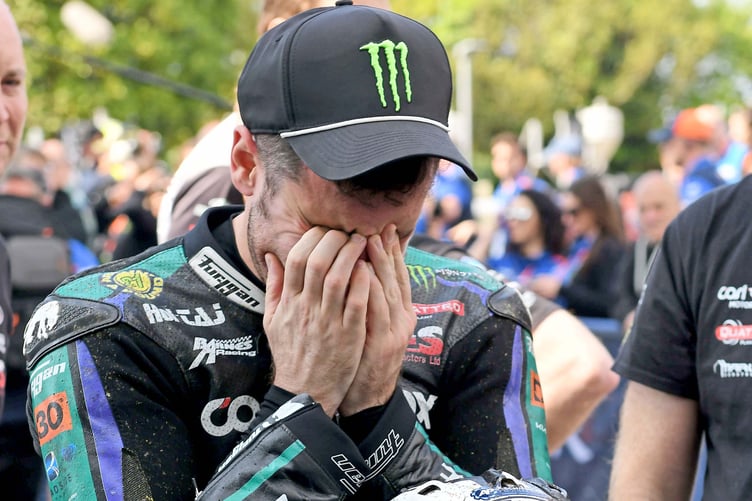 An emotional Michael Dunlop in the winners' enclosure after his 26th TT victory in the opening Supersport race of the 2024 Isle of Man TT (Photo: Dave Kneale)