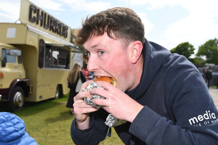 Tom enjoying his burger