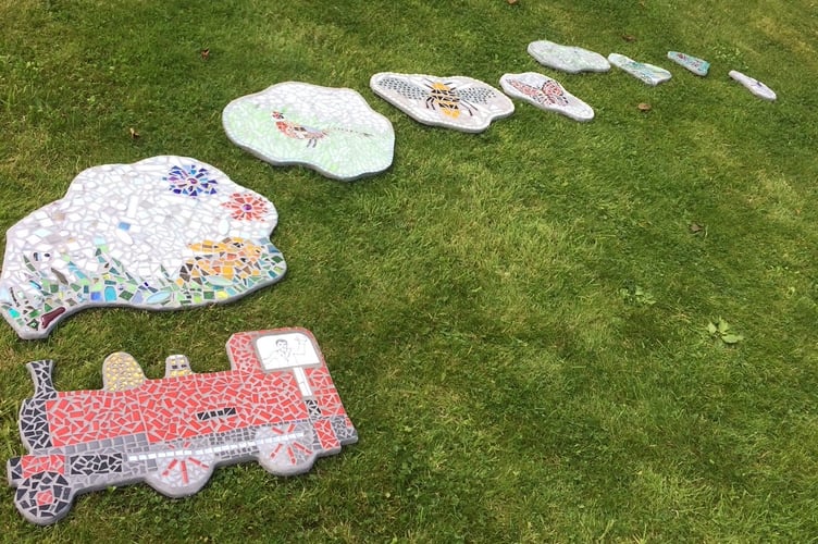A mosaic train created for Castletown train station by artist Debra Tracey