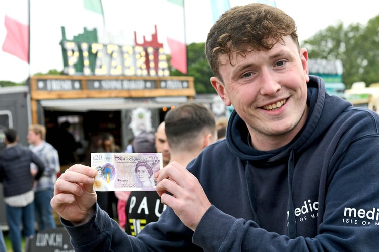 Tom Curphey with his £20 note set to embark on the challenge 