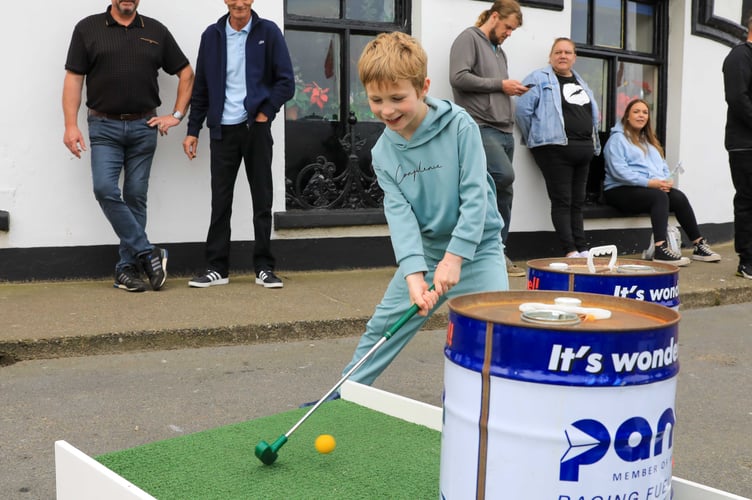 George, Aged 6 playing TT-themed mini golf at Peel TT Day
