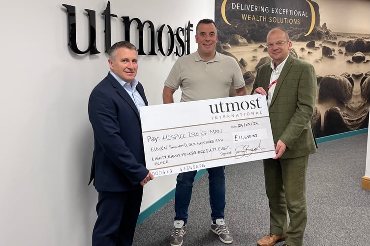Utmost International Isle of Man raised £15,000 for charity by selling old laptops to staff. Pictures (left-right) are Utmost CEO Karl Moore, service desk manager Craig Purvis and John Knight, of Isle of Man Hospice