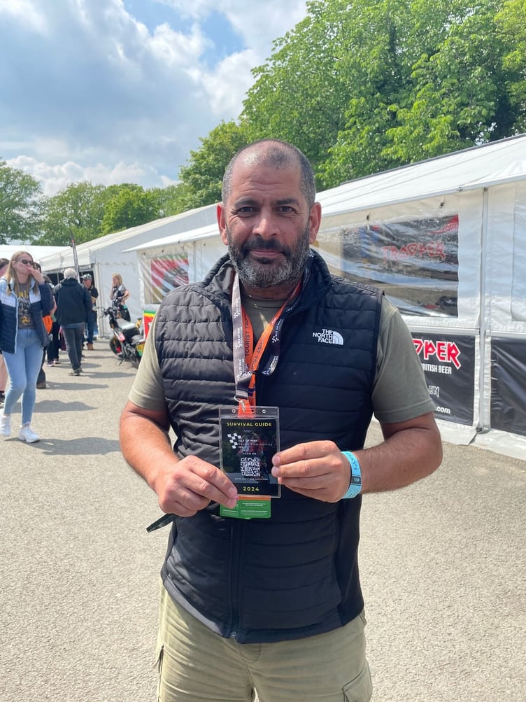 Chris Harris at the Grandstand with a survival guide lanyard on