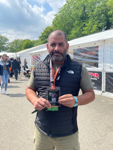 Chris Harris at the Grandstand with a survival guide lanyard on