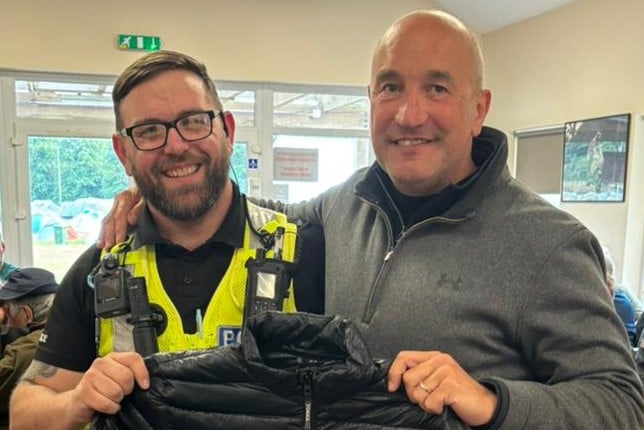 Police officer Craig Glover returns a stolen jacket to owner and TT visitor John Bellamy