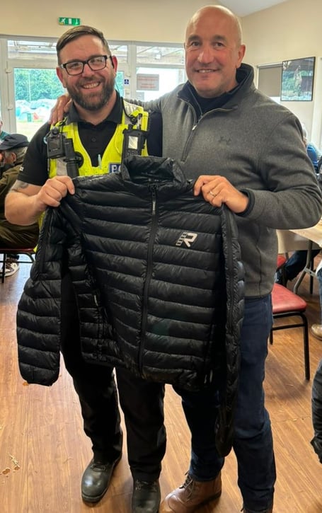 Police officer Craig Glover returns a stolen jacket to owner and TT visitor John Bellamy
