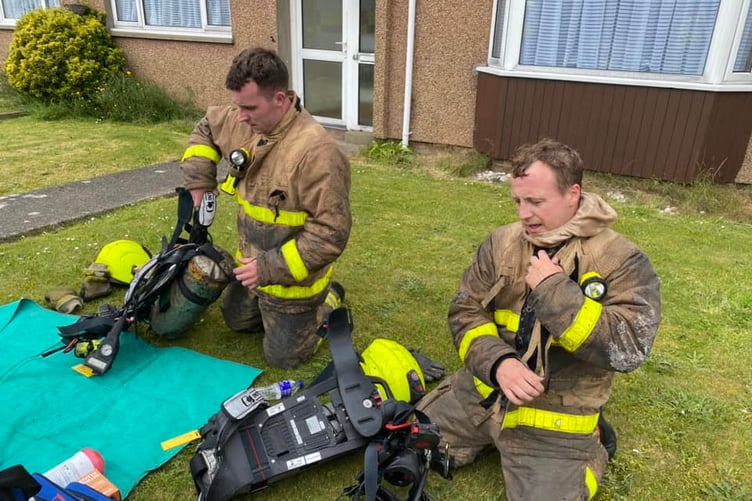 Firemen after tackling the blaze