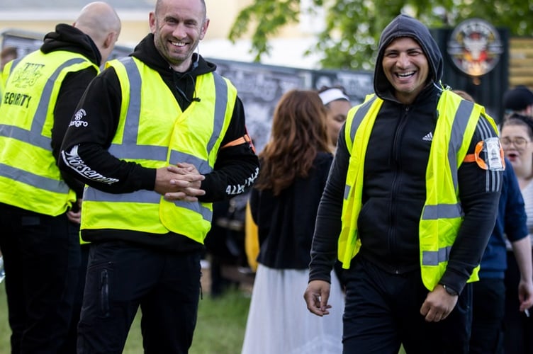 Security staff at Bushy's TT Village are all smiles