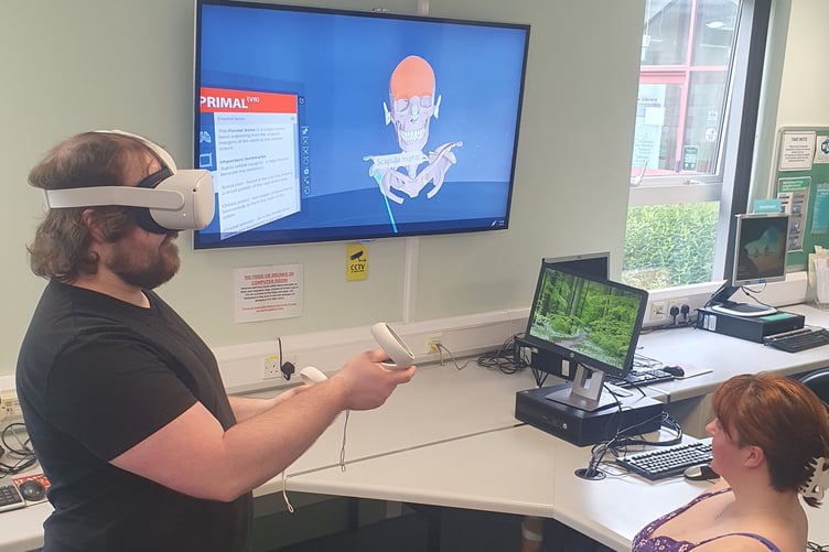 Manx Care staff using the new VR headset at Keyll Darree Library