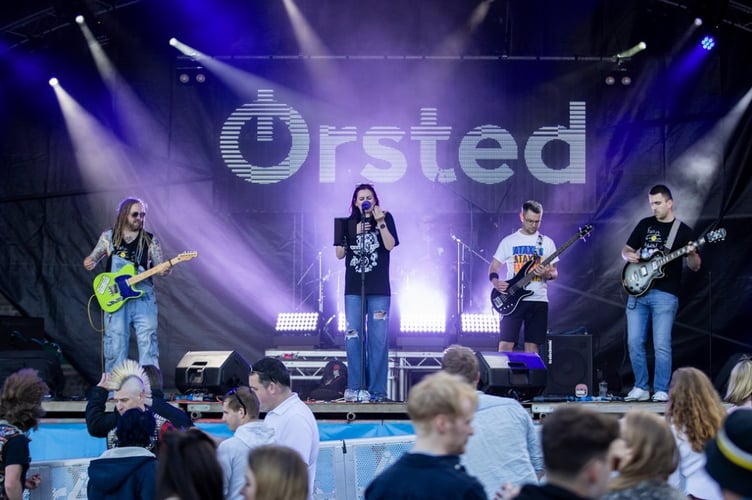 Fully Grown Adults perform at Bushy's TT Village 2024