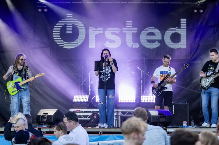 Fully Grown Adults perform at Bushy's TT Village 2024