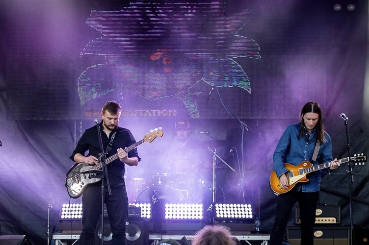 Bad Reputation entertain the crowd at Bushy's TT Village 2024