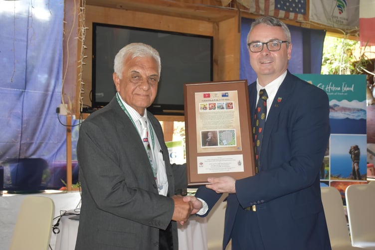 Speaker of the Legislative Council of St Helena Cyril Gunnell is presented with an Isle of Man Post Office stamp set by the Speaker of the House of Keys, Juan Watterson SHK, marking the connection between the two islands. The set depicts Colonel Mark Wilks, former Governor of St Helena and Speaker of the House of Keys
