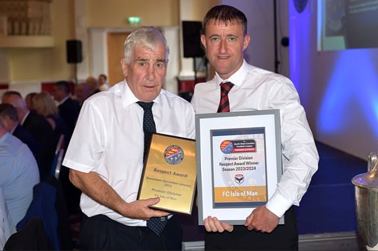 FC Isle of Man vice-chairman Lee Dixon (right) receives the Respect award from a representative of the North West Counties Football League at the recent AGM