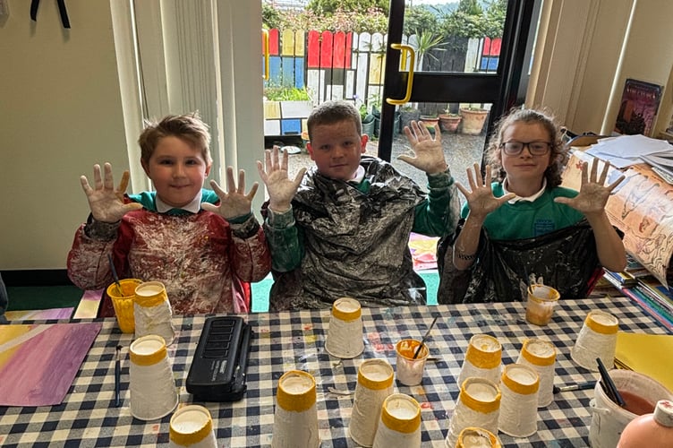 Dhoon school pupils creating some of the art work