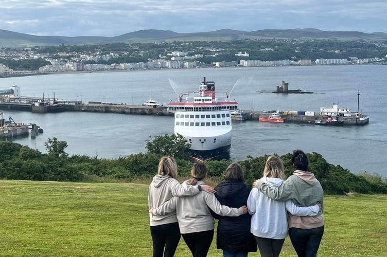 Paul's family watch as the Manxman sounds its horn and gives a water jet salute in tribute