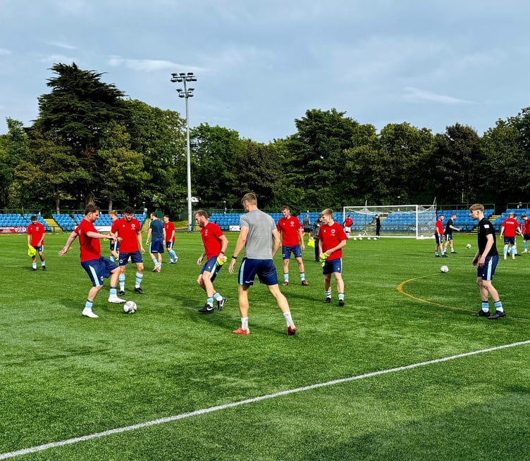 FC Isle of Man warming up ahead of Friday evening's game with Brackley Town