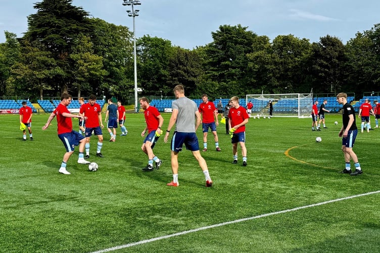 FC Isle of Man warming up ahead of Friday evening's game with Brackley Town