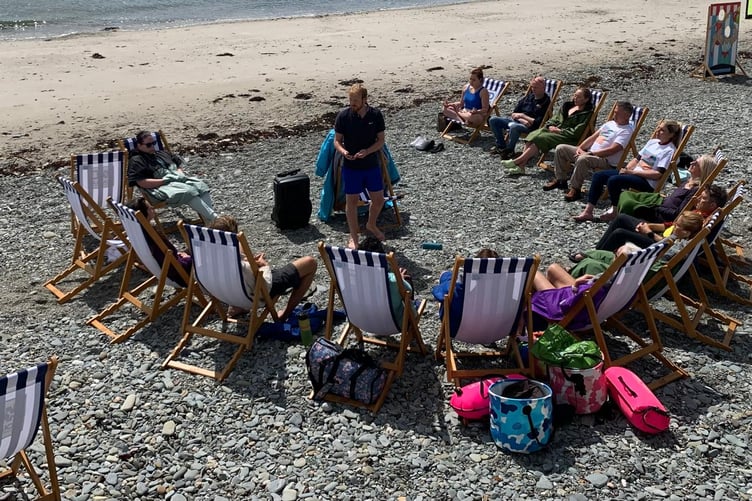 Wim Hof instructor Ian Kirk giving a session on the beach