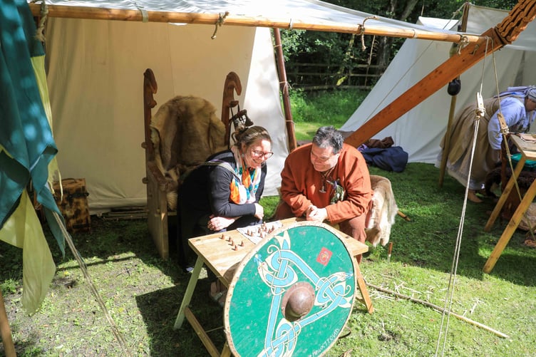 The Vikings playing board games in their village