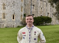 Scout David Cowin receives medal after helping at coronation 