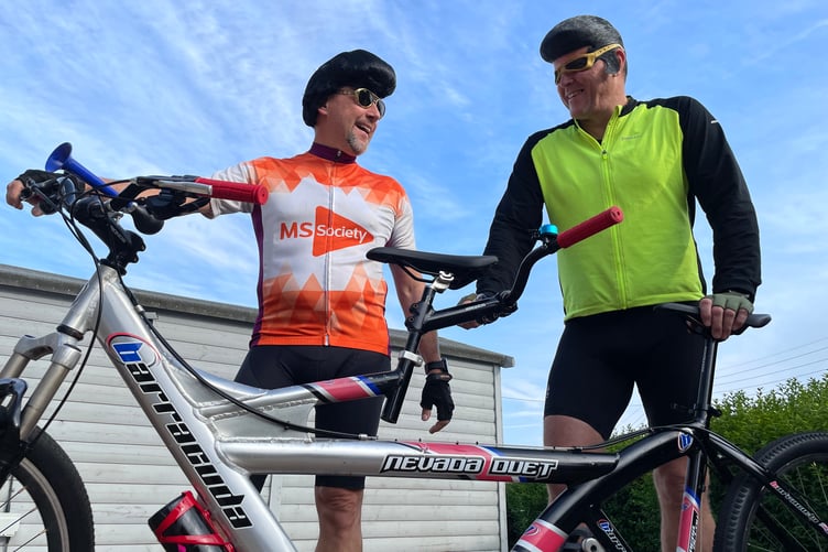 Anthony Long, Chairman of Capital International Group and Les Coates, Capital's Managing Director of Group services dressed as Elvis ready for their bike ride