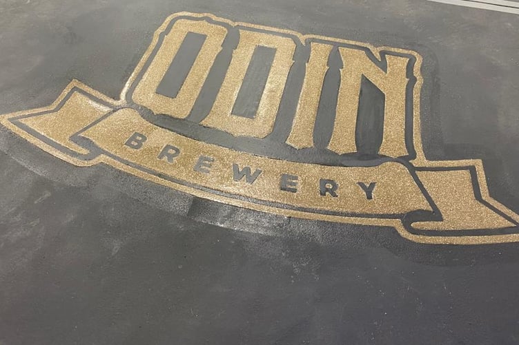 Odin's Manx Brewery logo on the floor of the new microbrewery