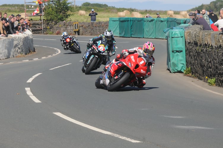 Davey Todd leads Michael Dunlop and Dean Harrison through Church Bends on his way to winning the Solo Championship race at the Southern 100 on Thursday afternoon (Photo: John Watterson)