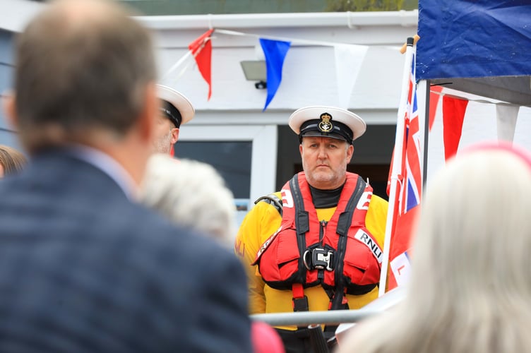 A Port St Mary RNLI volunteer watches on