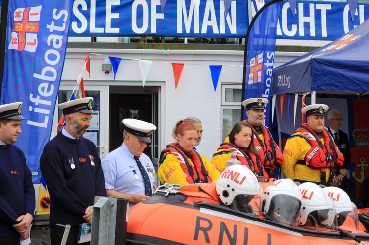 The lifeboat crew members line up during the ceremony
