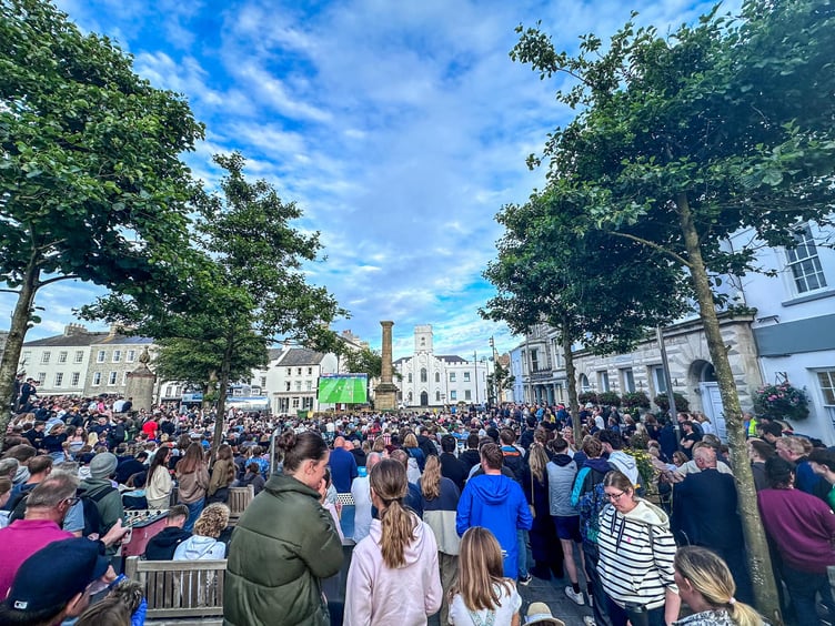 Crowds gather to watch the European Championship final between Spain and England in Castletown Market Square