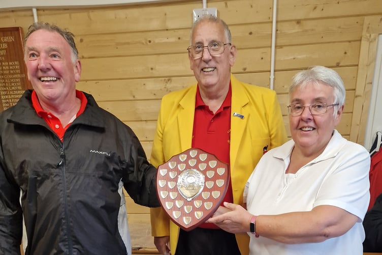 Lawn Bowls Club Isle of Man president Gary Lenton (centre) presents the President's Cup to winners Clive and Bernice McGreal