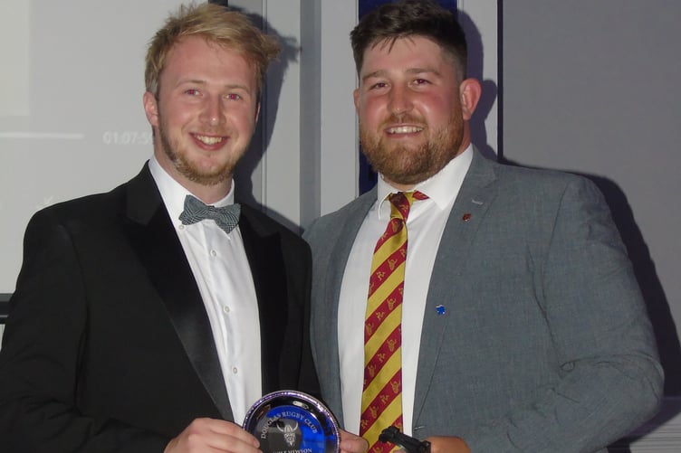 Wilf Hewson is presented the Most Improved Player award from coach Phil Cringle (right)