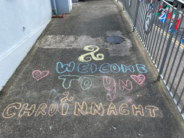 Kids chalk a welcome message at Peel Centenary Centre