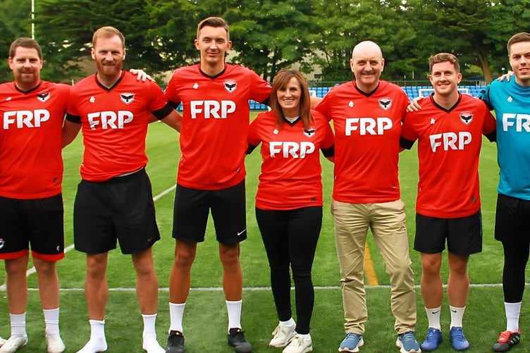 FRP directors Gordon Wilson and Kathleen McGhee with FC Isle of Man squad members and chairwoman Gill Christian (left) and director of football Lee Dixon (right)
